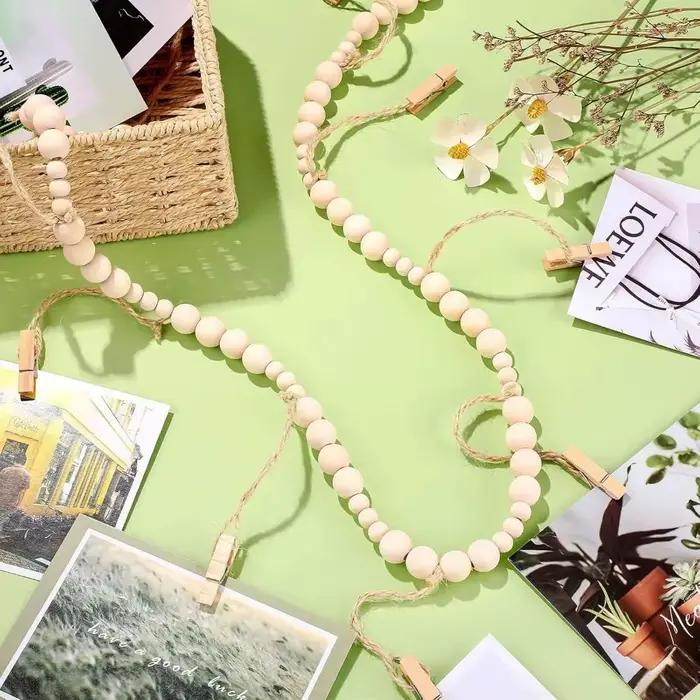 Chaîne murale porte-photos en bois avec clips à pompons et perles